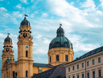 theatine-church-sunlight-cloudy-sky-munich-germany